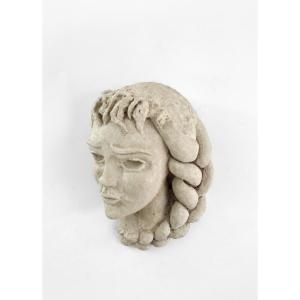 Reconstituted Stone Sculpture Representing A Woman's Face, 1960s.