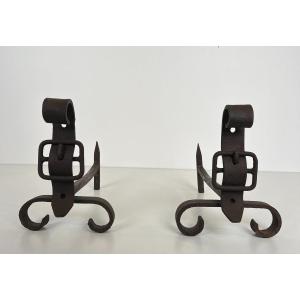 Pair Of Cast Iron And Wrought Iron Andirons Representing A Belt. French Work. Circa 1950