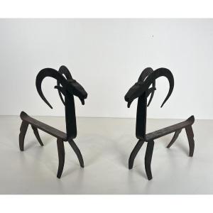 Pair Of Wrought Iron Andirons Representing A Goat. French Work In The Style Of Edouard Schenck.