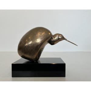 Bronze Sculpture Representing A Stylized Bird On A Black Marble Base, Signed And Numbered