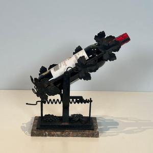 Wrought Iron Decanter With Vine Leaves Decoration On A Marble Base