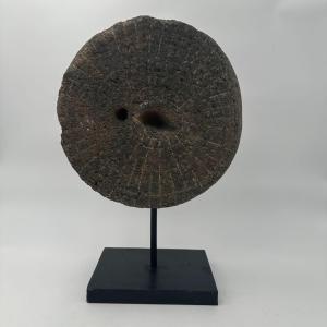 Decorative Element Made Of A Millstone On A Steel Base