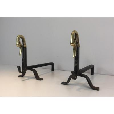 In The Style Of Maison Jansen. Pair Of Iron And Brass Andirons With Duck Heads. French. Circa 1