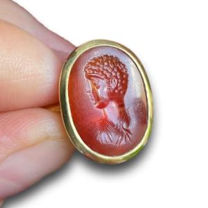 Gold Ring Set With An Ancient Carnelian Intaglio Of A Male Portrait Bust.