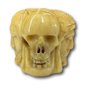 Bone Vanitas Rosary Bead Carved With Four Heads. French, 16th Century.