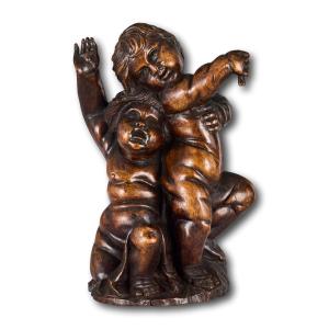 Walnut Figural Group Depicting Two Putti. Flemish, 17th / 18th Century.