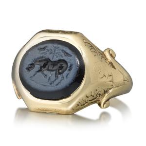 19th Century Gold Ring With An Ancient Roman Nicolo Intaglio Of A Horse.  