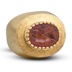 Gold Ring Set With An Ancient Carnelian Scarab Depicting A Deer Hunt.