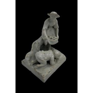 White Ceramic Statue Depicting A Woman And A Child