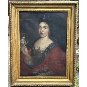 Portrait Of A Woman From The 17th Century Presenting A Miniature Of Her Child 