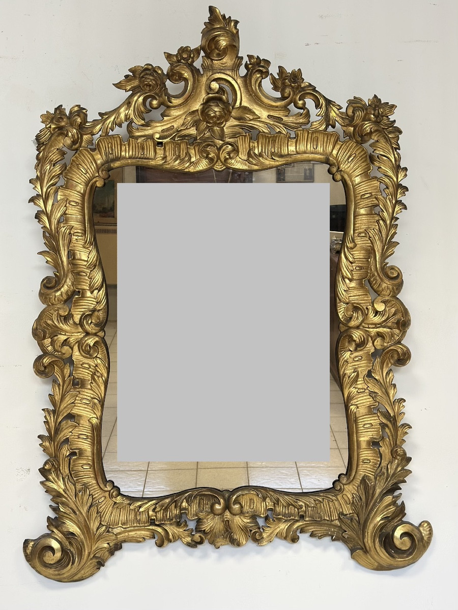 Specchiera con cornice in legno intagliato e dorato. Lombardia XVIII secolo