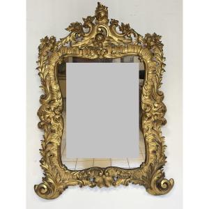 Specchiera con cornice in legno intagliato e dorato. Lombardia XVIII secolo