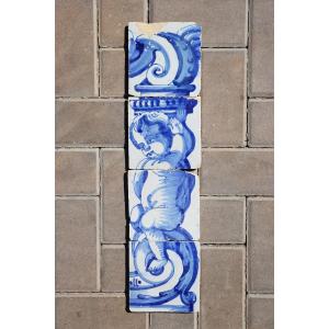 18th Century Set Of Four Tiles Depicting A Cherub Holding A Baroque Torchiere