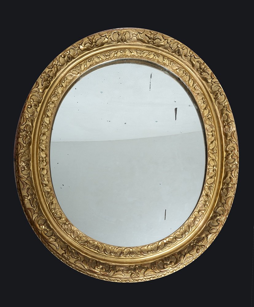 Specchiera antica Luigi XVI Francese in legno dorato e intagliato con specchio a mercurio.