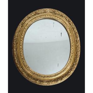 Specchiera antica Luigi XVI Francese in legno dorato e intagliato con specchio a mercurio.