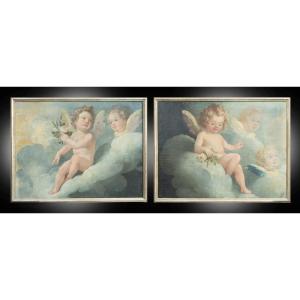 Coppia di dipinti antichi olio su tela raffigurante putti alati in atteggiamento gioioso.