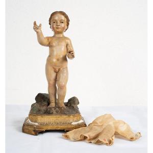 Scultura antica napoletana in legno policromo raffigurante bambino benedicente.
