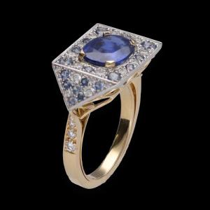 Ring With An Unheated Ceylon Sapphire And Brilliant Diamonds In Yellow And Grey Gold