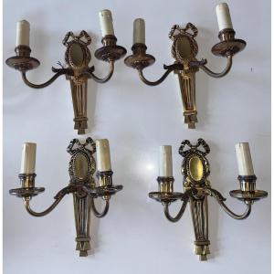 Petitot (20th Century) Series Of Four Art Deco Wall Lights With Medallions, In Chiseled Gilt Bronze