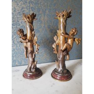 Pair Of Candlesticks With Putti In Spelter And Red Marble Base. 19th Century. 