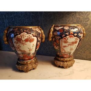 Pair Of Imari Vases (japan) With Bronze-gilt Bases And Garlands. 19th Century. 
