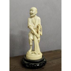 Okimono In Ivory, Depicting A Fisherman And His Net