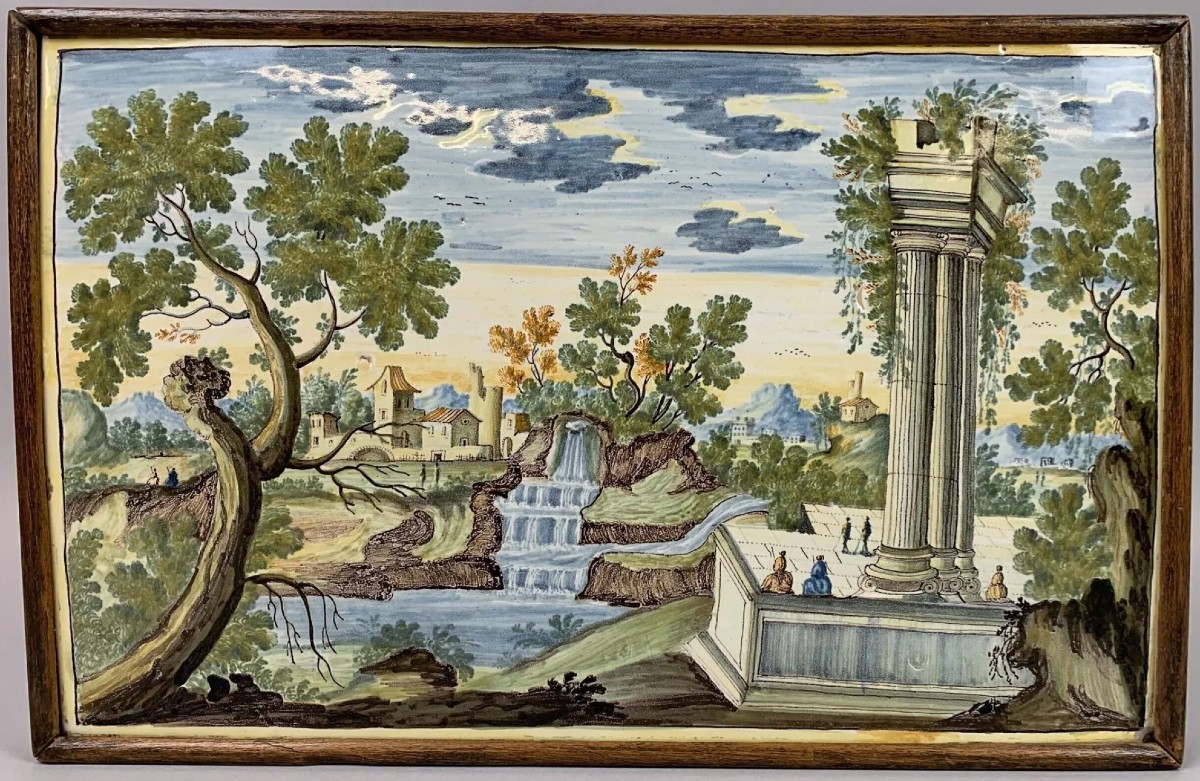 Placca maiolica Castelli, XVIII secolo, raff. "Paesaggio con personaggi e rovine"