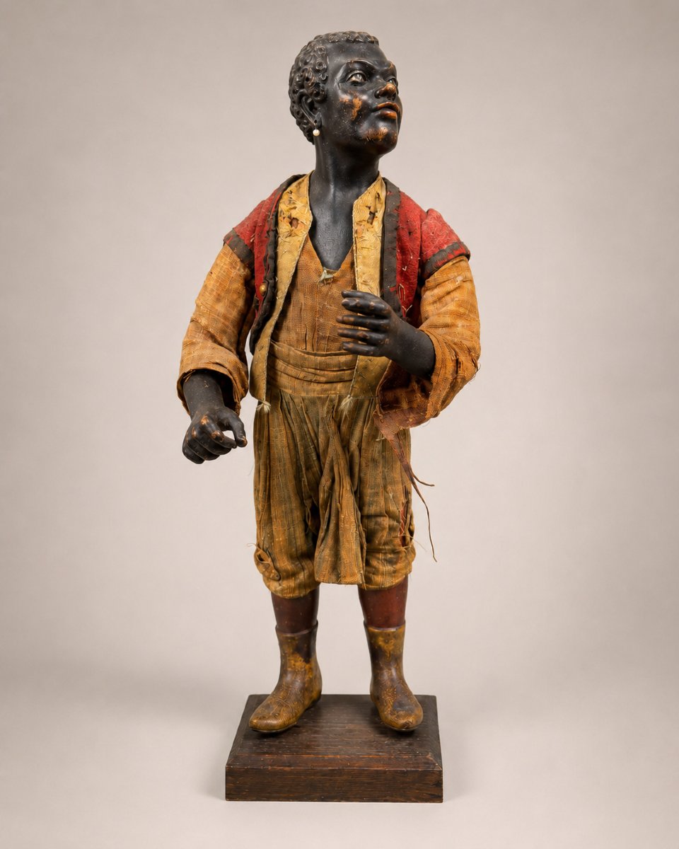 Giovane moro "Blackamoor" in legno laccato e stoffa, XIX secolo