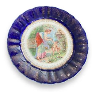 Plate Terre De Fer Cupid Getting His Wings Cut