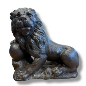 Lion Holding A Cast Iron Sphere 
