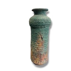 Vase In Foam Color With A Green Patina
