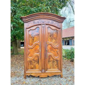  Large Louis XV Period Walnut Wardrobe With A Gendarme's Hat-shaped Top, 18th Century.