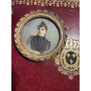 Miniature Young Girl With A Bun