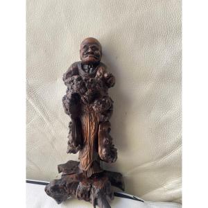 Wooden Sculpture Of An Asian Figure 