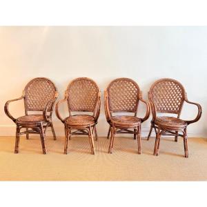 Suite Of 4 Rattan Chairs With Armrests From The 60s.
