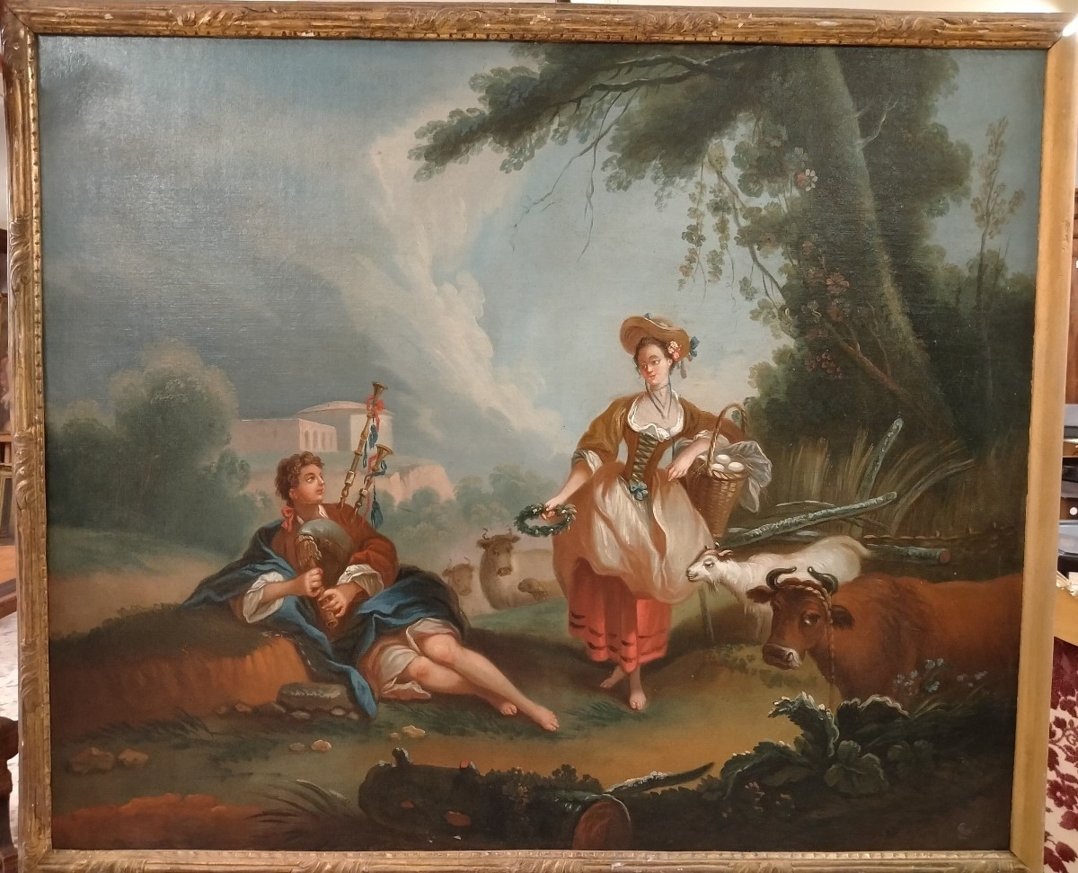 Olio su tela raffigurante coppia di personaggi con animali. La fanciulla reca in mano un cesto 