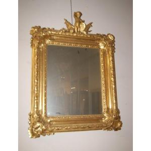 Stupenda specchiera francese della prima metà del 1800, in legno dorato foglia oro