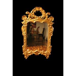 Specchio da parete in legno finemente intagliato e dorato - XIX secolo