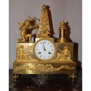 Orologio da tavolo Impero con cupido e muse in bronzo dorato al mercurio