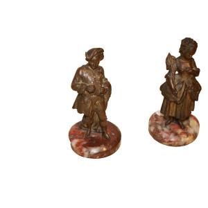 Statuette decorative in bronzo dorato e brunito