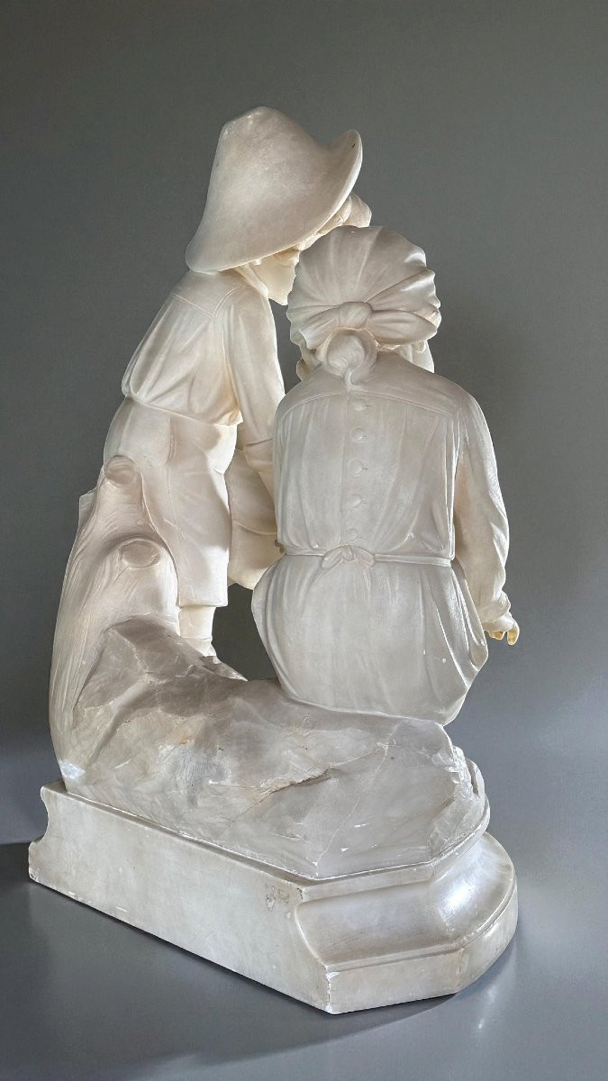 Statua due bambini che si scaldano accanto al fuoco-photo-7