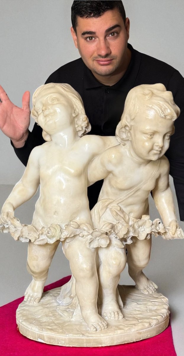 Statua raffigurante Putti con ghirlande di fiori -photo-2