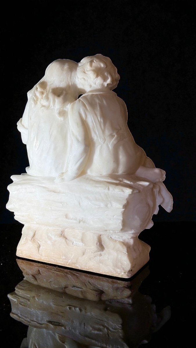 Statua raffigurante una Coppia di Fanciulli che giocano con un cane -photo-1