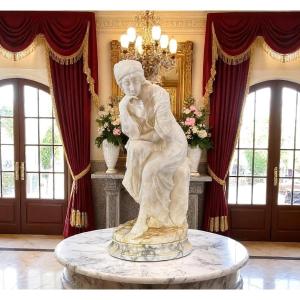 Statua raffigurante una donna seduta, con una mano sul mento • Guglielmo PUGI 