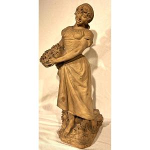 Young Woman With Terracotta Fruit Basket