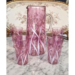 Enameled Glass Pitcher And Orangeade Glasses On A Pink Background