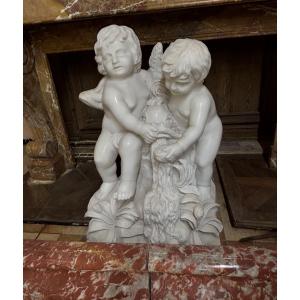 Beautiful White Marble Group Depicting Two Babies Sitting With A Fish 