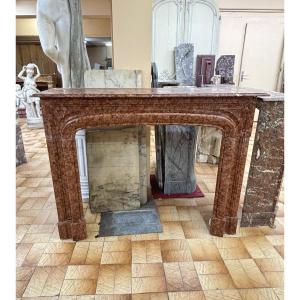 Antique Louis XIV Style Fireplace Known As Boudin Made Of Orange Marble From The Late 19th Century 