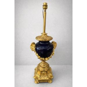 Late 19th Century Blue Porcelain Lamp Decorated With Garlands Held By Rams' Heads.