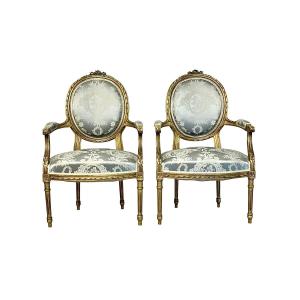 Pair Of Louis XVI Medallion Carved And Gilded Wood Armchairs